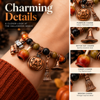 Close-up detail of Halloween charm bracelet featuring pumpkin, witch hat, candy and broom charms